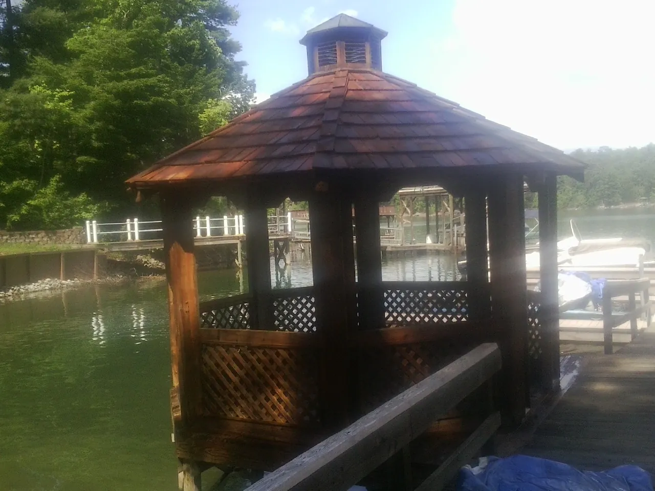 Cedar shake gazebo roof rebuilt on a lake dock in Saint Marys
